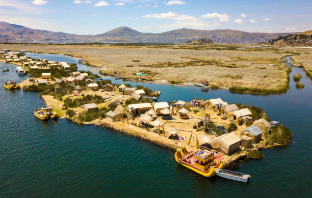 Aerial view of floating islands at Lake Titicaca Aerial view of floating islands of Uros at Lake Titicaca sedge stock pictures, royalty-free photos & images