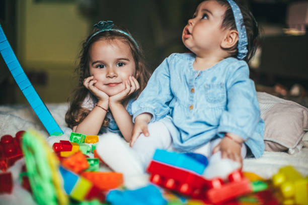istock Kids playing with toys 957285412