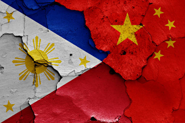 istock flags of Philippines and China painted on cracked wall 957298002