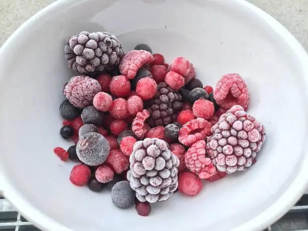 Frozen superfood berries in a white bowl