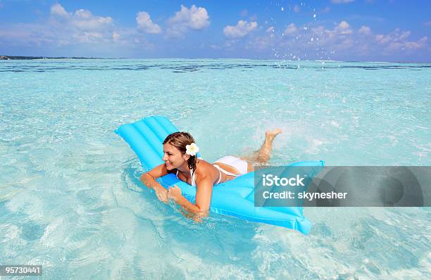 Happy Woman Floating On Inflatable Mattress Stock Photo - Download Image Now - Mattress, Adult, Adults Only
