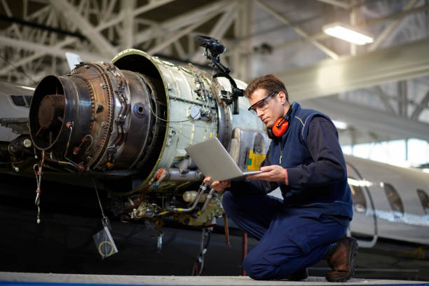 istock Aircraft mechanic in the hangar 957305204