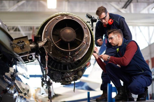 istock Aircraft mechanics in the hangar 957305314