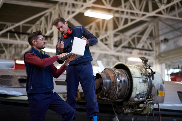 istock Aircraft mechanics in the hangar 957305320