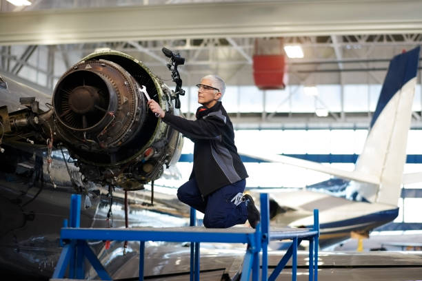 istock Aircraft mechnic in the hangar 957305460