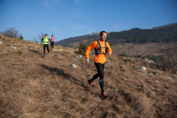 istock Men and woman running 957305662
