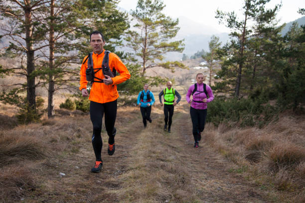 istock Men and women running 957305672