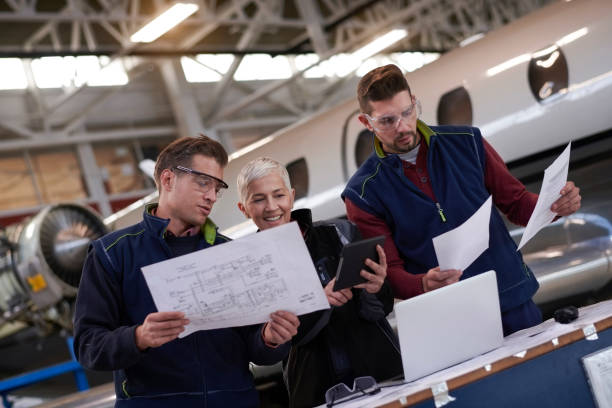 istock Aircraft mechanics in the hangar 957305740