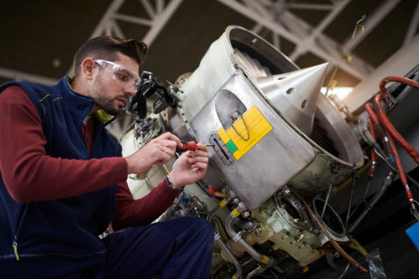 istock Aircraft mechanic in the hangar 957306556