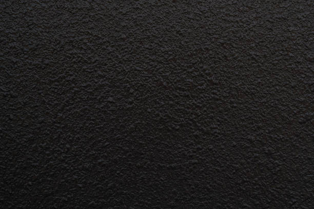 istock Dark grey black slate stone wall background or texture. 957311758