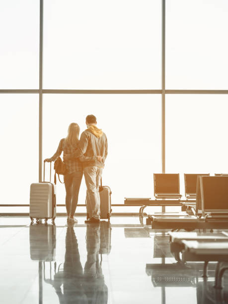 istock Female hugging man in airport 957316190