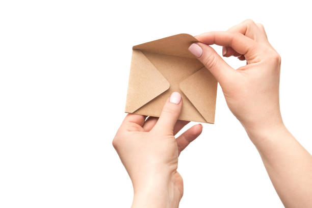 istock Female hand holds an vintage old envelope 957316572