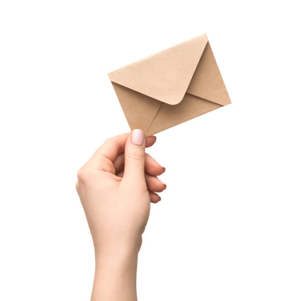 istock Female hand holds an vintage old envelope 957316754