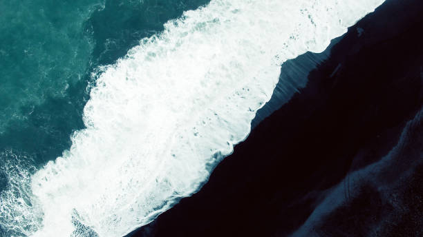 istock Aerial view on black sand beach 957317122