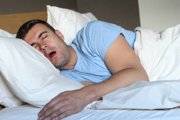 istock Passed out man drooling in bed 957318582