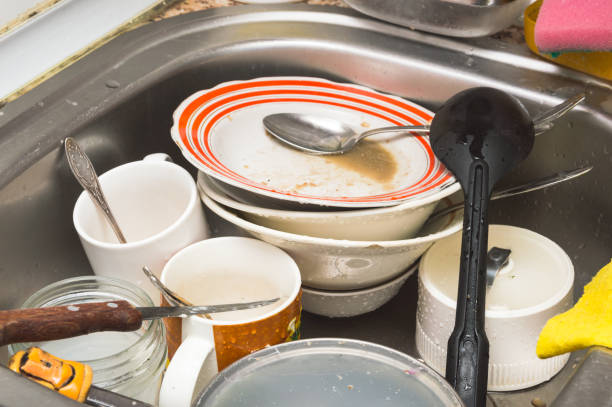istock Dirty unwashed kitchen utensils and dishes in the sink 957323746