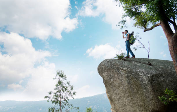 istock A man on top of the rock 957328016