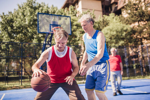 istock Seniors playing basketball. 957331788
