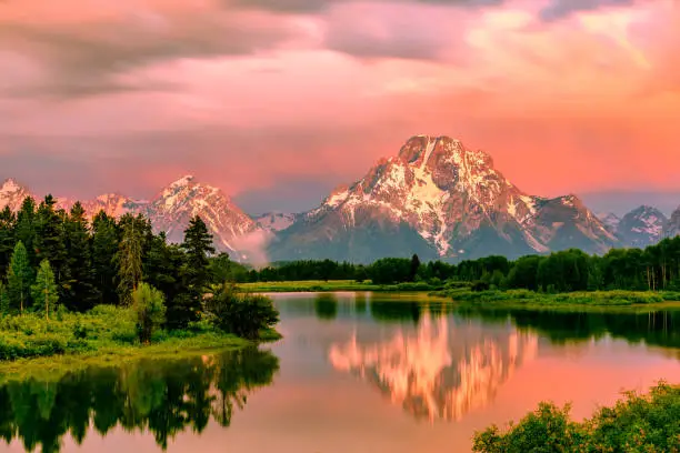 Photo of Mountains in Grand Teton National Park at sunrise. Oxbow Bend on the Snake River.