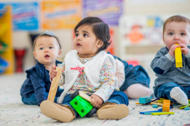 istock Group Of Kids In Daycare 957338866