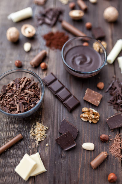 istock Delicious chocolate on wooden background 957349678
