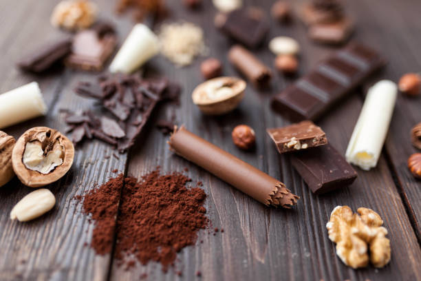 istock Delicious chocolate on wooden background 957350448