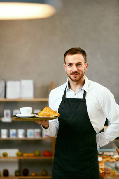 istock Man Selling Bakery In Pastry Shop 957351404