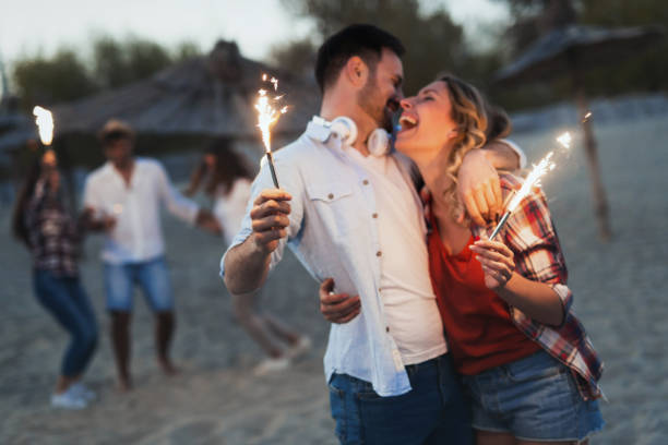 istock Truly happy playful couple having fun at beach 957352196