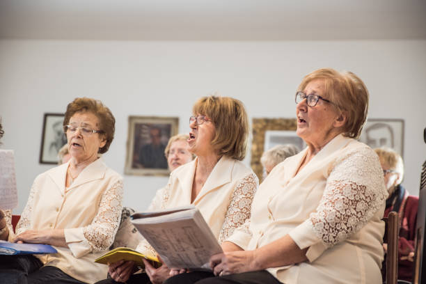 istock Senior Women Singing at Choir Practice 957353682