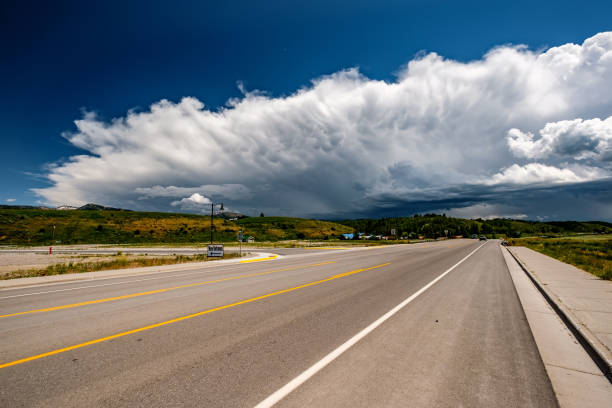 istock Empty open highway and stormy clouds in Wyoming 957358576