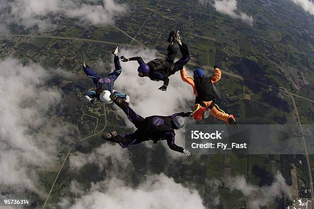 Four Skydivers Stock Photo - Download Image Now - Connection, Skydiving, Adventure