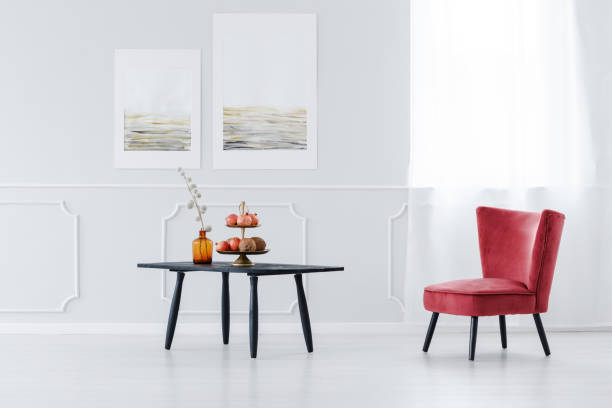 istock Black table and pink armchair 957363354