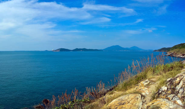 istock Beautiful coastline with waves hitting rocks on the beach 957364376