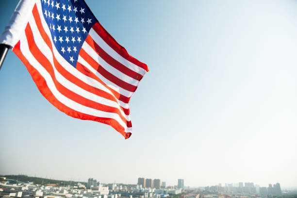 istock Waving American flag and building 957365098
