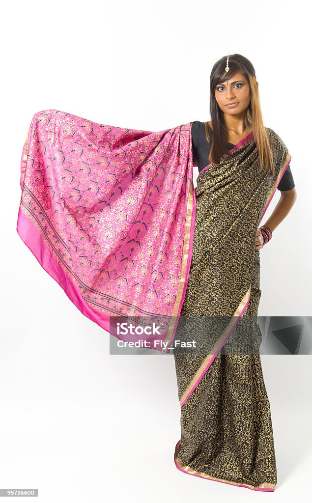 East Indian Woman Wearing a Saree An East Indian woman wearing a black and pink Saree. 20-24 Years Stock Photo
