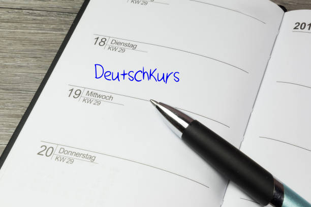 istock A calendar, ballpoint pen and appointment for the German course 957366336