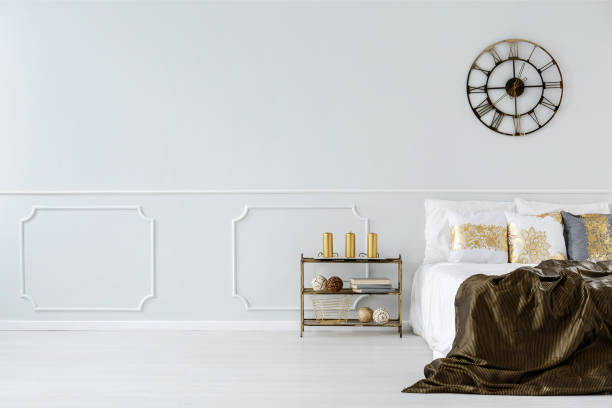 istock Bed with golden pillows and bedding 957368976