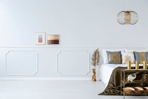 istock Elegant bedroom with golden decorations 957368978