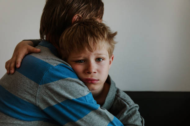 istock Father comforting sad child, parenting, sorrow 957372714