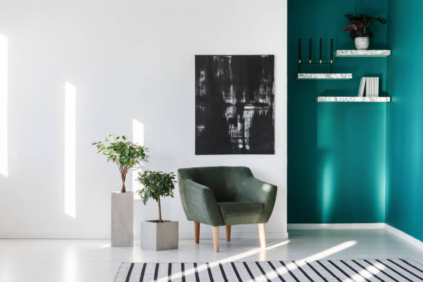 istock Painting, armchair and plants 957372750