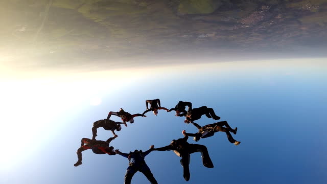 Skydiving friends at the sunset