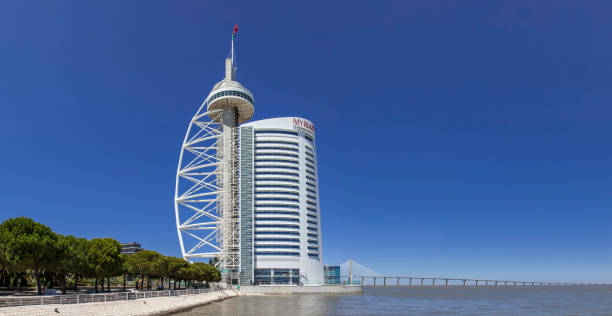Lisbon, Portugal - August 02, 2013: Vasco da Gama Tower, Myriad Hotel and the Vasco da Gama Bridge in Parque das Nacoes aka Park of Nations