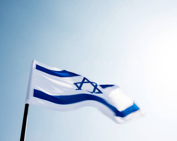 istock Israel's national flag in the wind 957379340