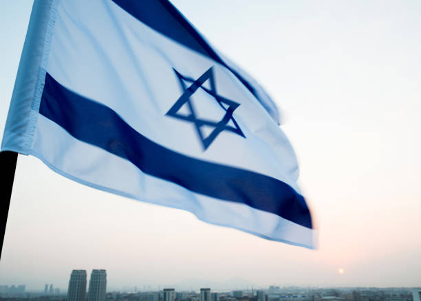 istock Israel's national flag in the wind 957379506
