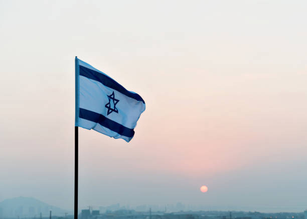 istock Israel's national flag in the wind 957379652