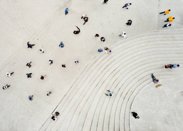 istock High Angle View Of People On Street 957384184
