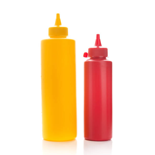 istock container of ketchup and mustard bottles 957384440
