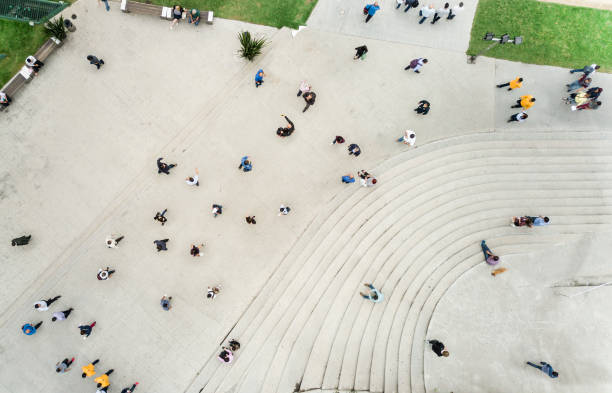 istock High Angle View Of People On Street 957384516