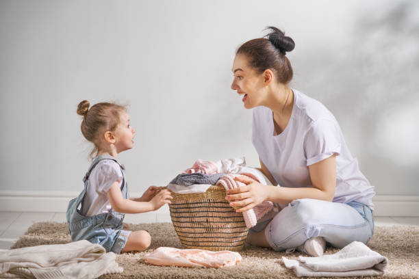 istock family doing laundry at home 957387760