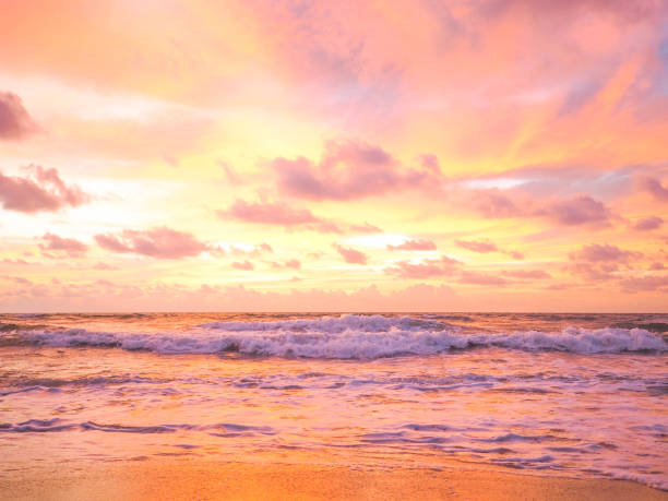 istock Colorful sunset on the tropical beach with beautiful sky, clouds, soft waves. 957388714